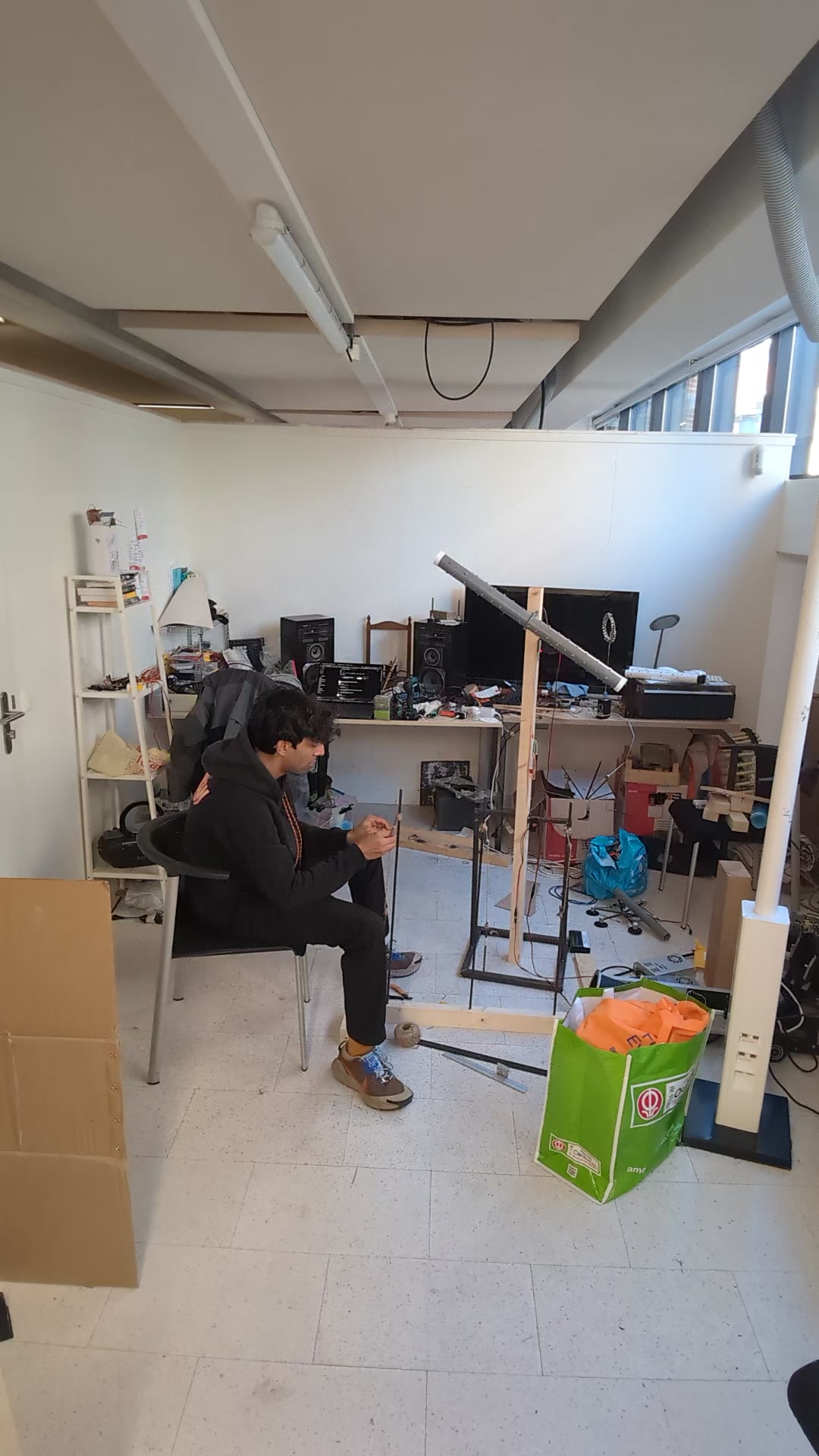 Studio, wide shot (1): found materials and an installation starting to take up space.